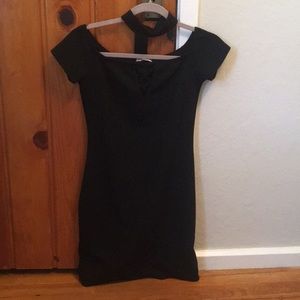 Form-fitting collard black dress